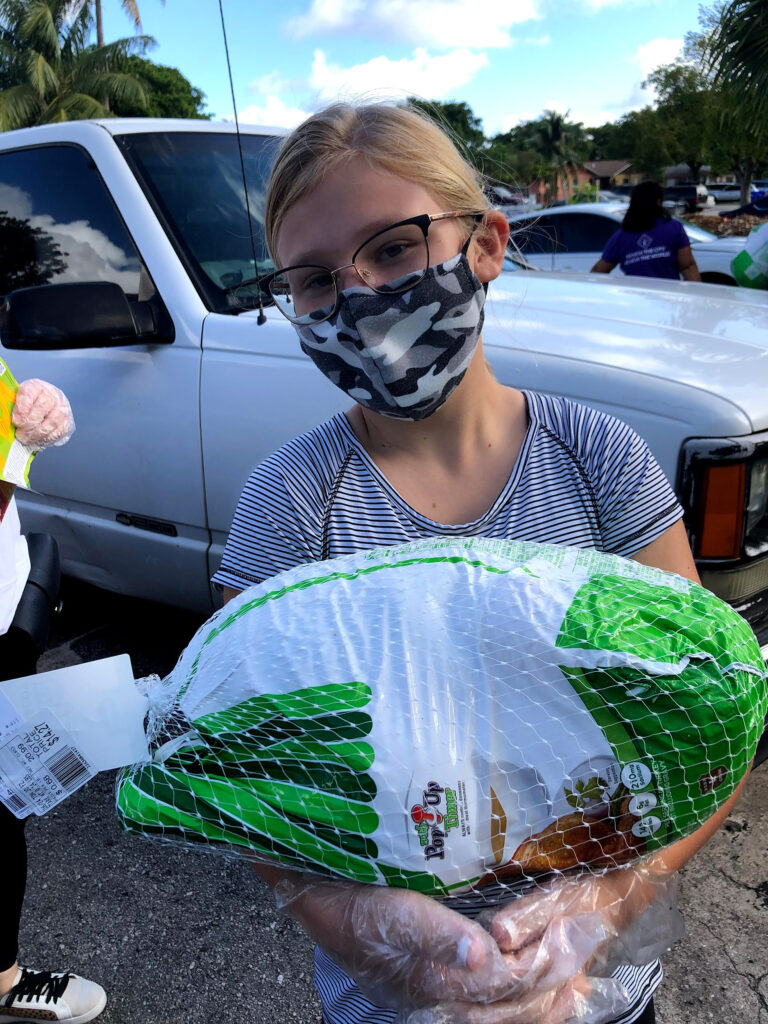 Love Serves Kid Serving Turkey the homeless projects second featured