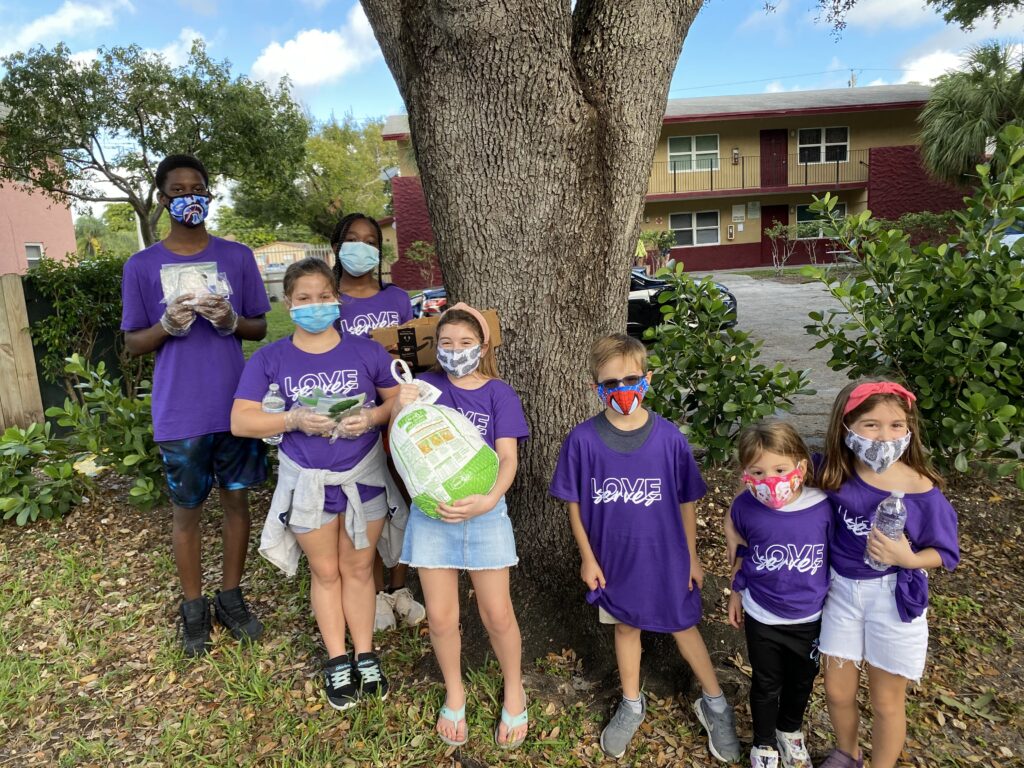 The Homeless Projects Love Serves Children Donating Food