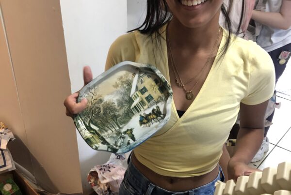 The Homeless Projects High schol students cleaning and setting up houses