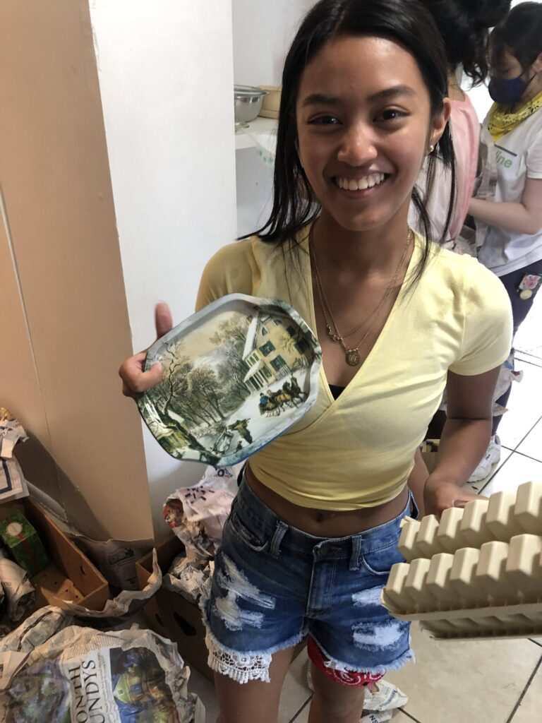 The Homeless Projects High schol students cleaning and setting up houses