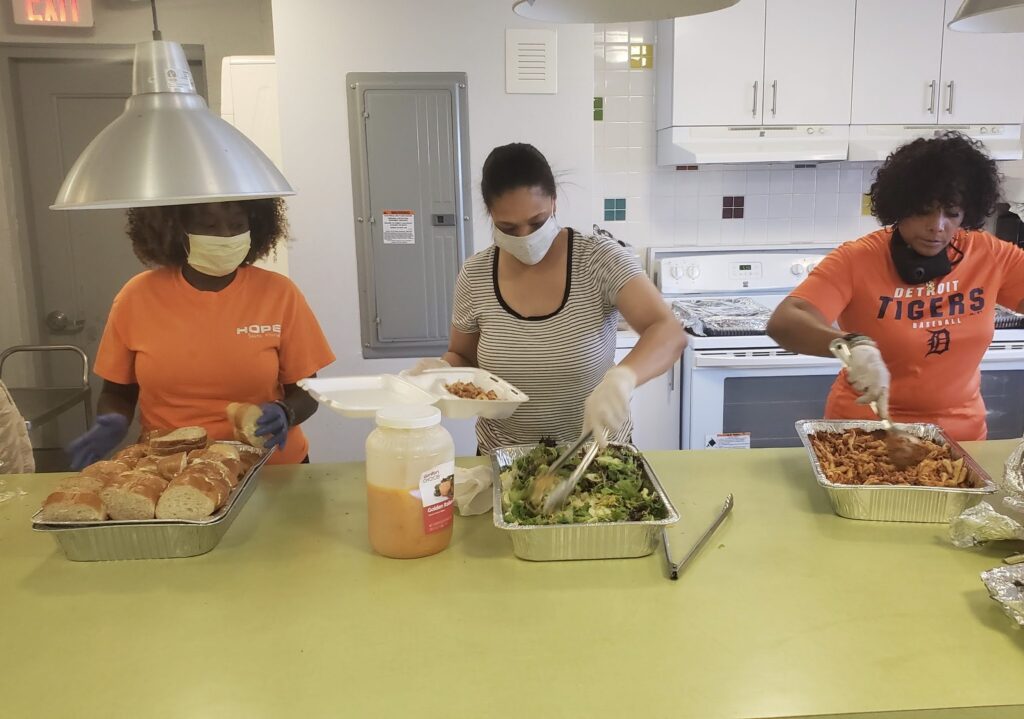 The Homeless Projects cooking food volunteers