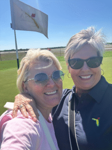 HomesUnited Ministries Annual Golf Classic Action 2 players servers Alice Mellor Helping Donors