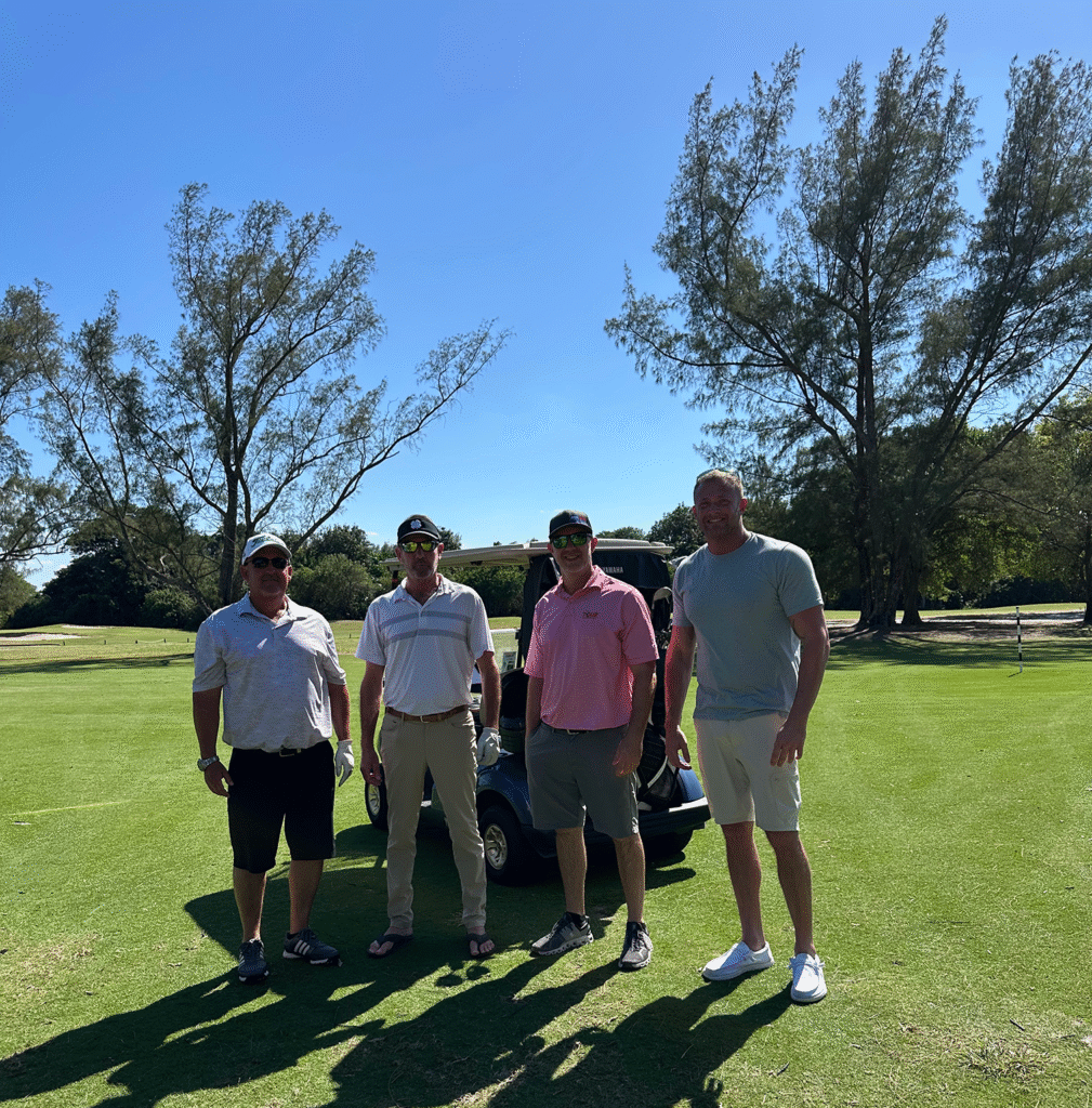 HomesUnited Ministries Donor Sponors playing golf on the green