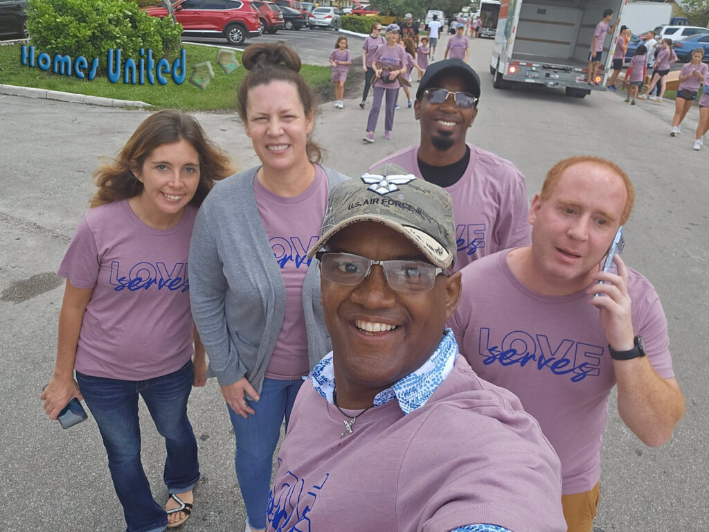 HomesUnited Staff and Alumni Serving Turkeys for ThanksGiving