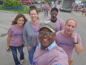 HomesUnited Staff and Alumni Serving Turkeys for ThanksGiving