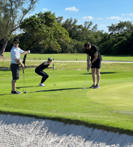 HomesUnited Ministries Annual Golf Classic Action peekaboo golf players competing