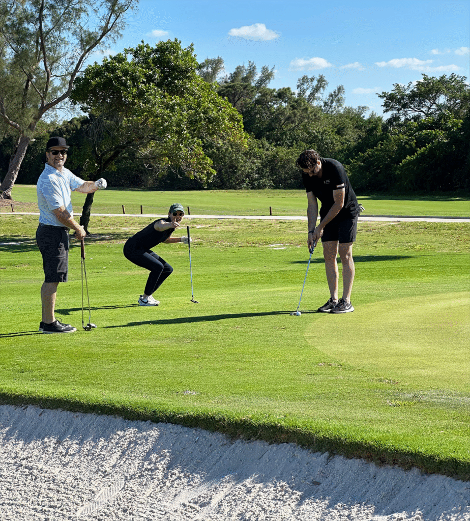 HomesUnited Ministries Annual Golf Classic Action peekaboo golf players competing